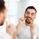 man flossing