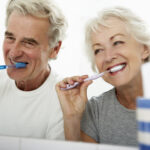 Couple Brushing Teeth